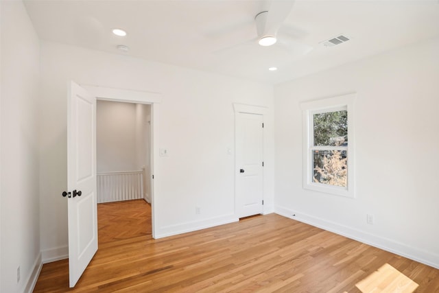 unfurnished bedroom featuring ceiling fan and light hardwood / wood-style flooring