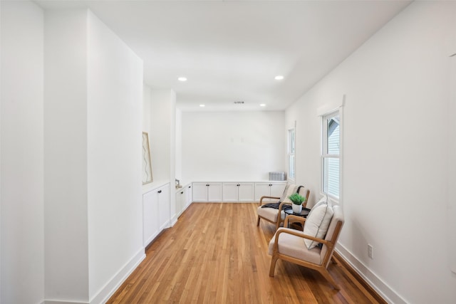 living area with light hardwood / wood-style floors