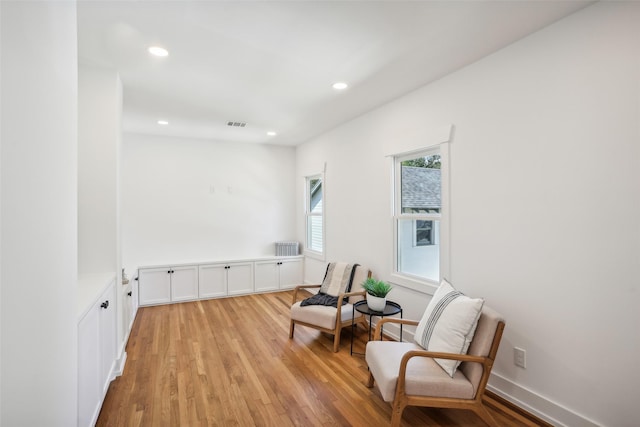 living area with light hardwood / wood-style floors