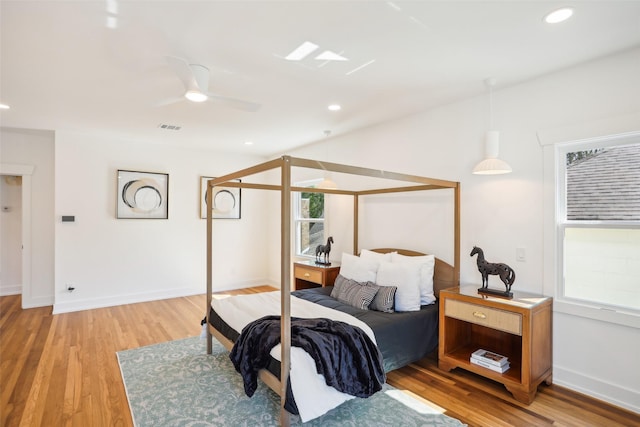 bedroom featuring ceiling fan and wood-type flooring