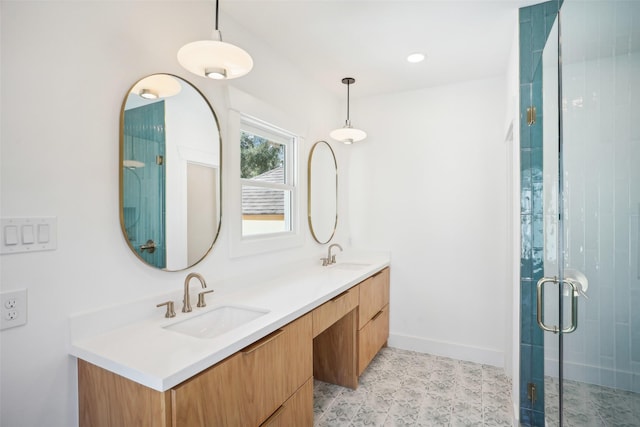 bathroom featuring vanity and an enclosed shower