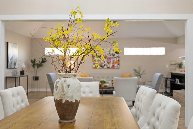 dining space with wood-type flooring