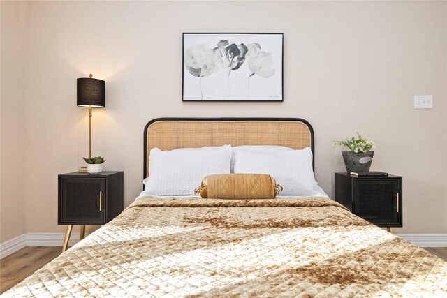 bedroom featuring wood-type flooring