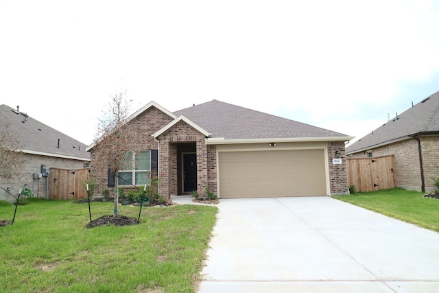 single story home with a front yard and a garage