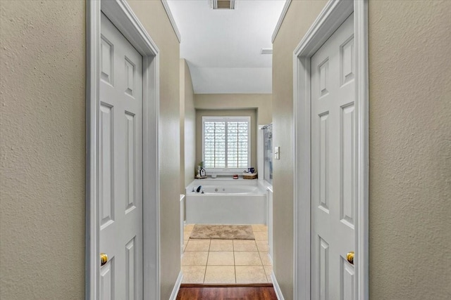 corridor featuring hardwood / wood-style flooring