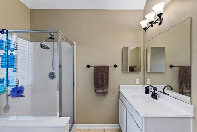 bathroom featuring tile patterned floors, vanity, and walk in shower