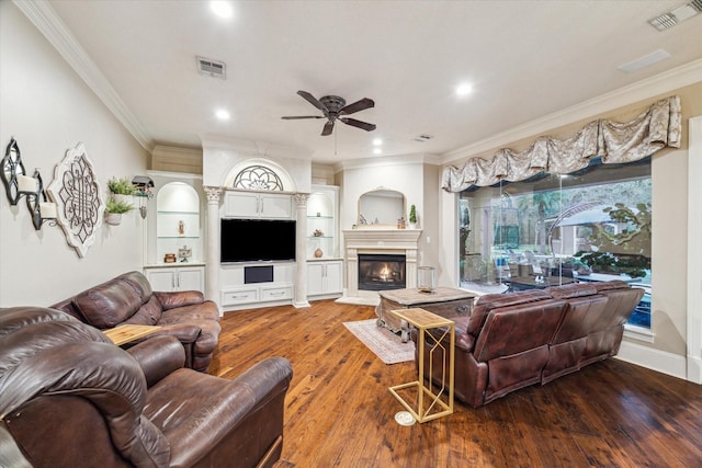 living room with hardwood / wood-style floors, ceiling fan, and ornamental molding