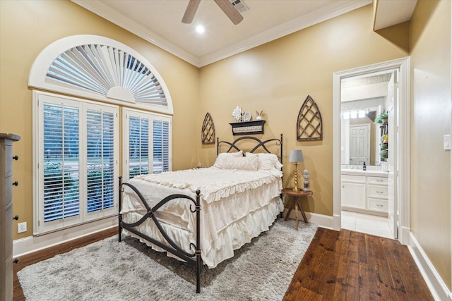 bedroom featuring ensuite bath, ceiling fan, crown molding, and dark hardwood / wood-style floors