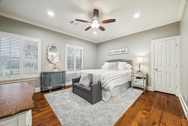 bedroom featuring ceiling fan, dark hardwood / wood-style floors, and ornamental molding