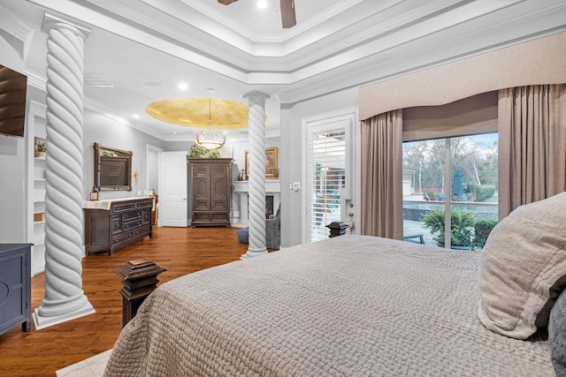 bedroom featuring access to exterior, ornate columns, ornamental molding, ceiling fan, and dark hardwood / wood-style floors