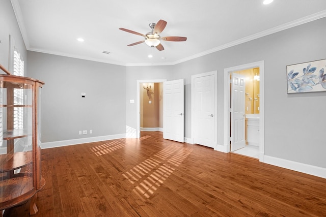 interior space featuring ceiling fan, wood-type flooring, and crown molding