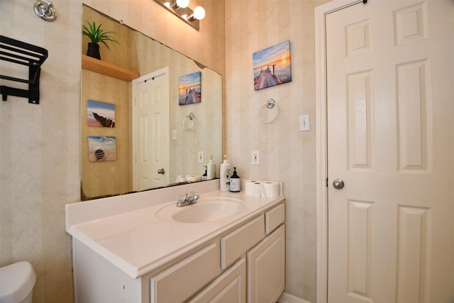 bathroom with vanity and toilet