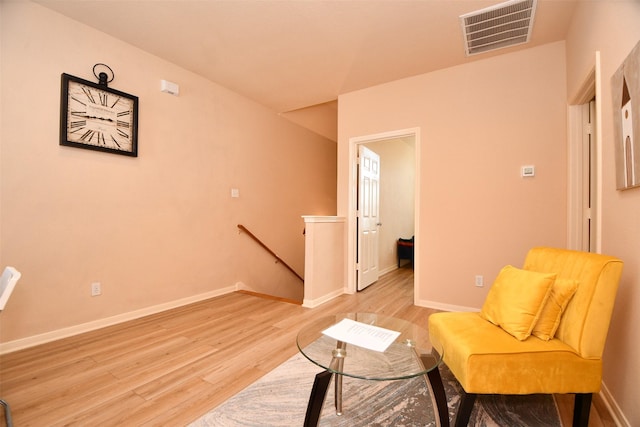 sitting room featuring light hardwood / wood-style flooring