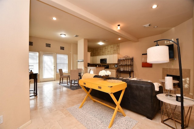 living room featuring beam ceiling