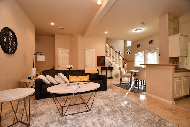 living room with beam ceiling