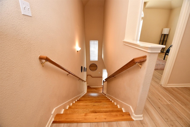 stairs with wood-type flooring