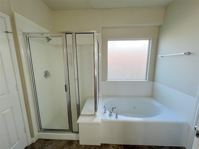 bathroom with separate shower and tub