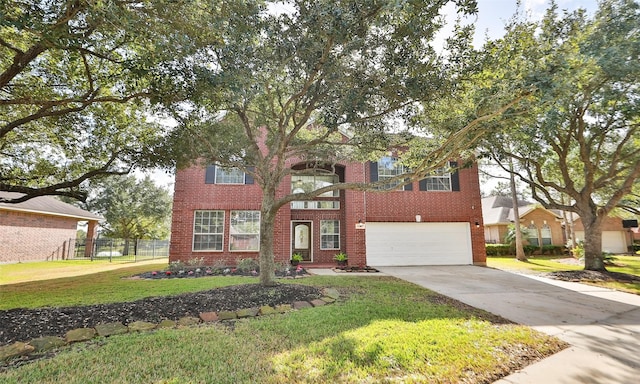 view of front facade featuring a front lawn and a garage