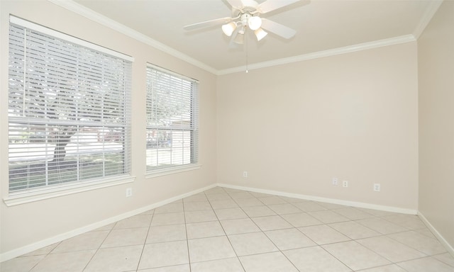 tiled spare room featuring ceiling fan and crown molding