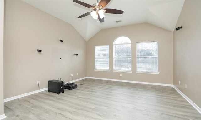 interior space with ceiling fan, light wood-type flooring, and vaulted ceiling