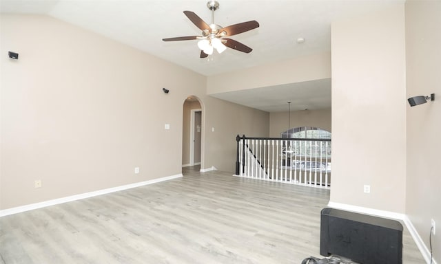 spare room with ceiling fan, light hardwood / wood-style floors, and lofted ceiling