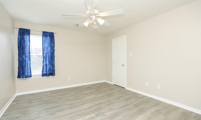 unfurnished room with ceiling fan and light hardwood / wood-style flooring