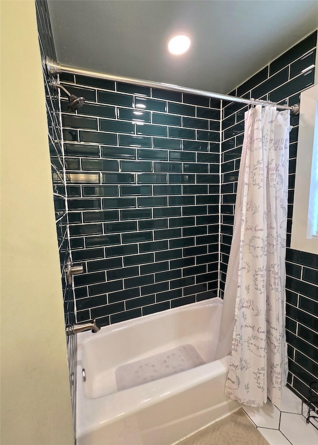 bathroom featuring tile patterned flooring and shower / tub combo with curtain