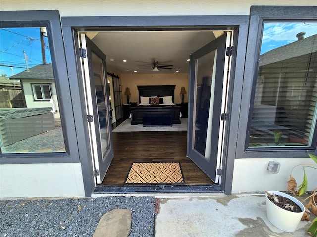 entrance to property featuring stucco siding