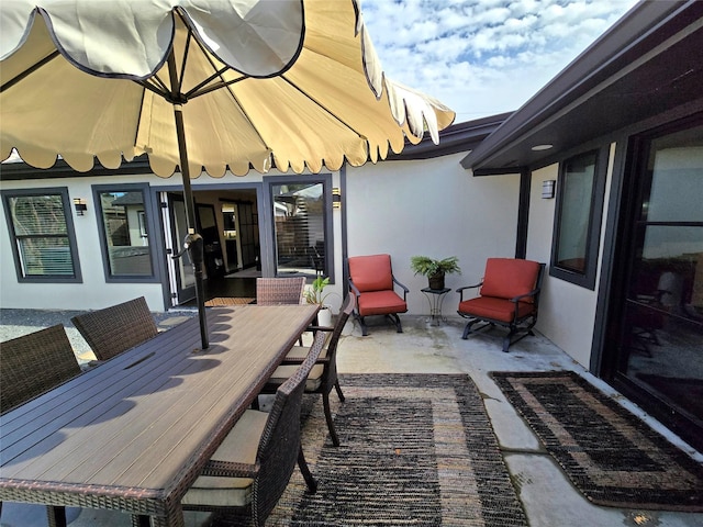 view of patio with outdoor dining area