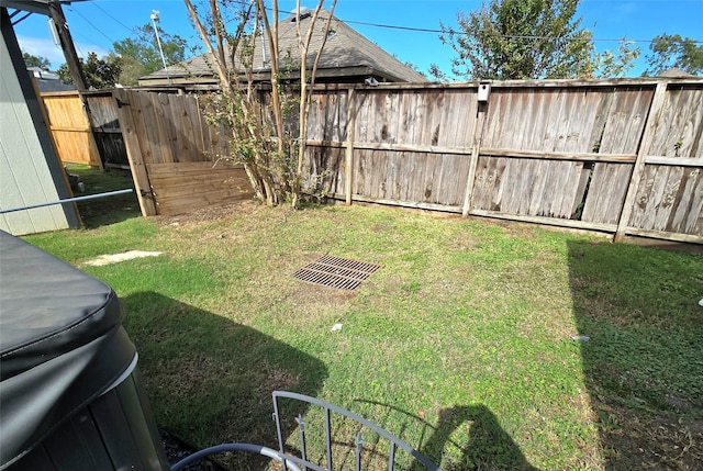 view of yard with a fenced backyard