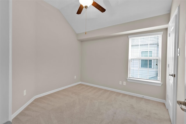 unfurnished room featuring ceiling fan, lofted ceiling, and light carpet