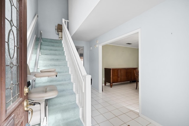 stairs featuring tile patterned floors