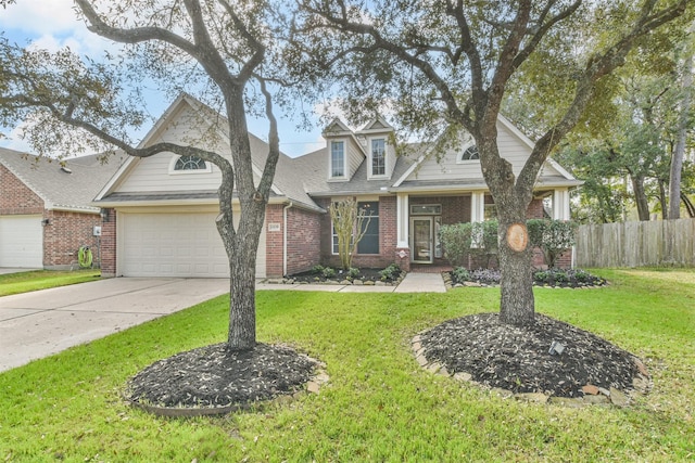 view of front of home with a front yard and a garage