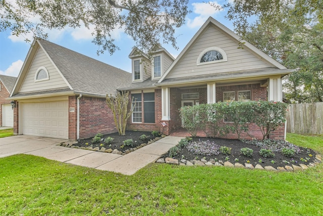 view of front facade with a garage and a front yard