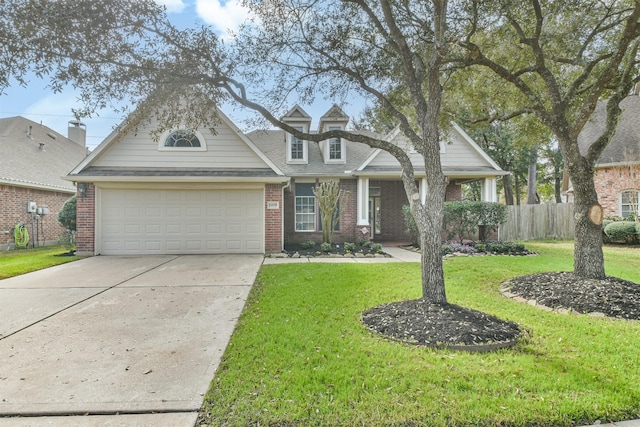 view of front of home featuring a garage and a front lawn