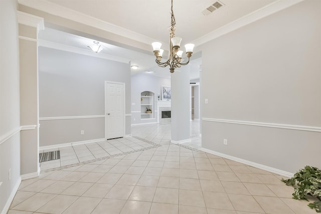 tiled empty room featuring an inviting chandelier and ornamental molding