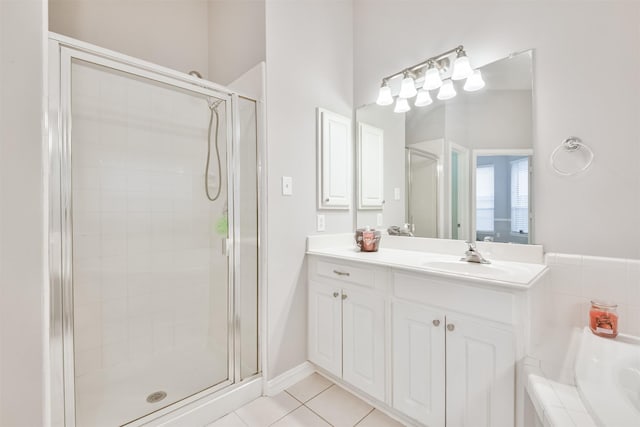 bathroom featuring tile patterned floors, vanity, and an enclosed shower