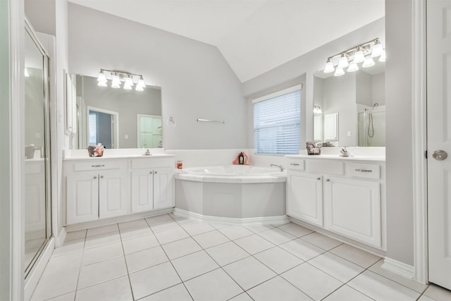 bathroom with vanity, tile patterned floors, separate shower and tub, and vaulted ceiling