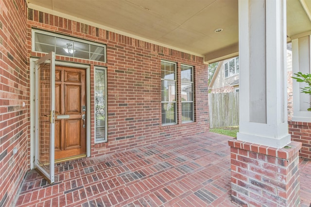 entrance to property featuring a porch