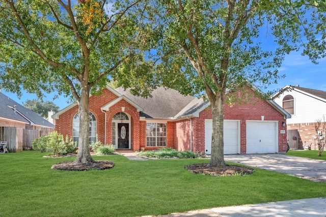 view of front facade featuring a front yard and a garage