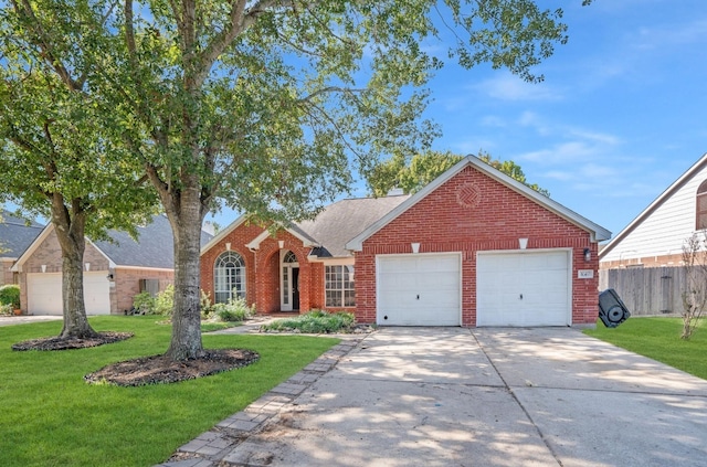 view of front facade featuring a front yard and a garage