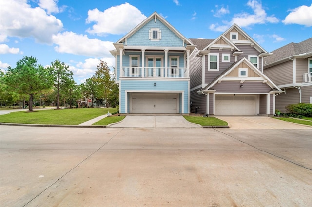 view of front of property featuring a garage and a front yard