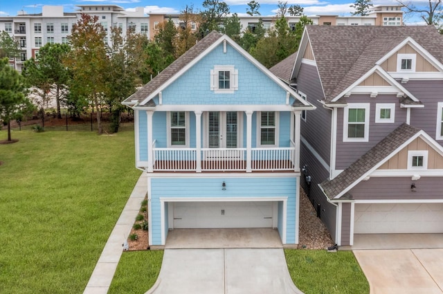 view of front of home featuring a front yard and a garage