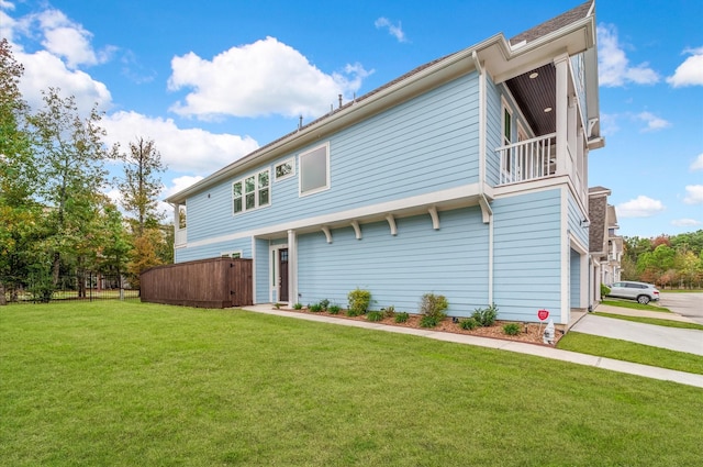 back of property with a yard and a garage