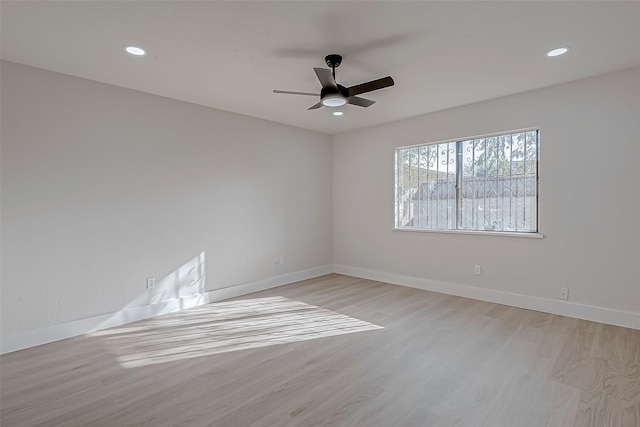 unfurnished room with ceiling fan and light hardwood / wood-style flooring