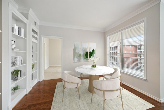 dining space featuring dark hardwood / wood-style floors and crown molding