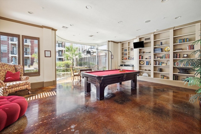 recreation room with built in features, crown molding, and billiards