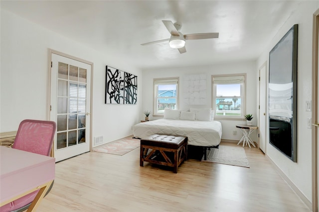 bedroom with ceiling fan and light wood-type flooring