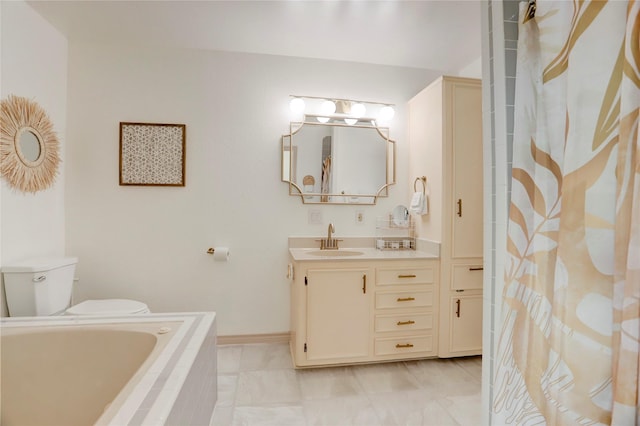 bathroom with vanity, a relaxing tiled tub, and toilet