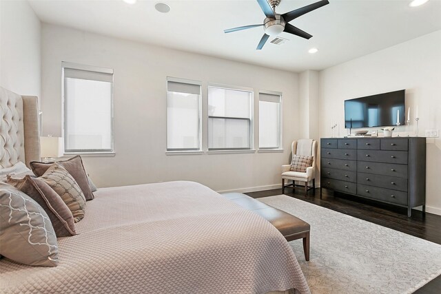 bedroom featuring ceiling fan and dark wood-type flooring